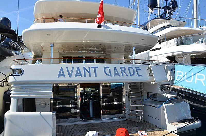 a large white boat with a sign on it aboard PHOTON Yacht for Sale