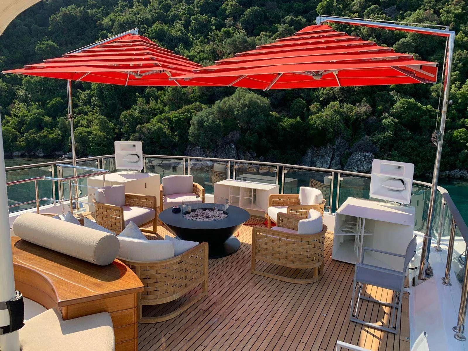 a patio with a table and chairs aboard PHOTON Yacht for Sale