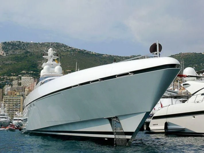 a large white ship in the water aboard RABDAN Yacht for Sale