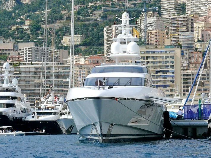 a large white boat in the water aboard RABDAN Yacht for Sale