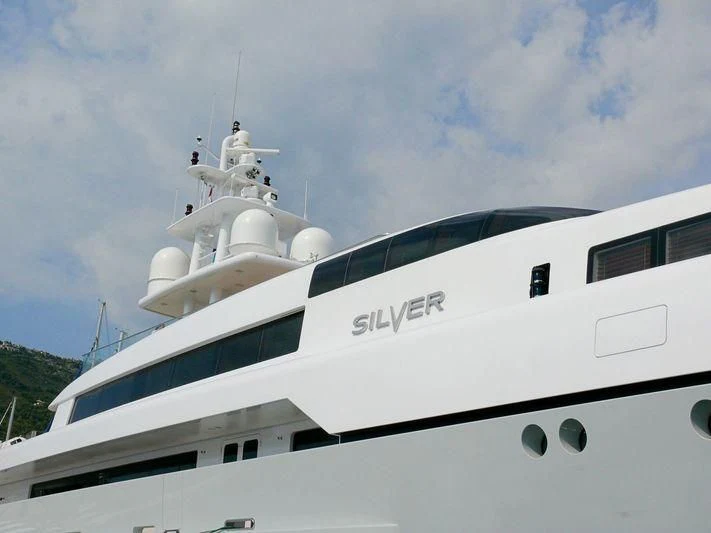a white yacht on the water aboard RABDAN Yacht for Sale