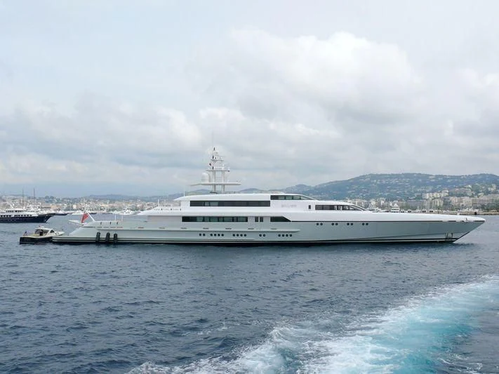 a large white ship in the water aboard RABDAN Yacht for Sale