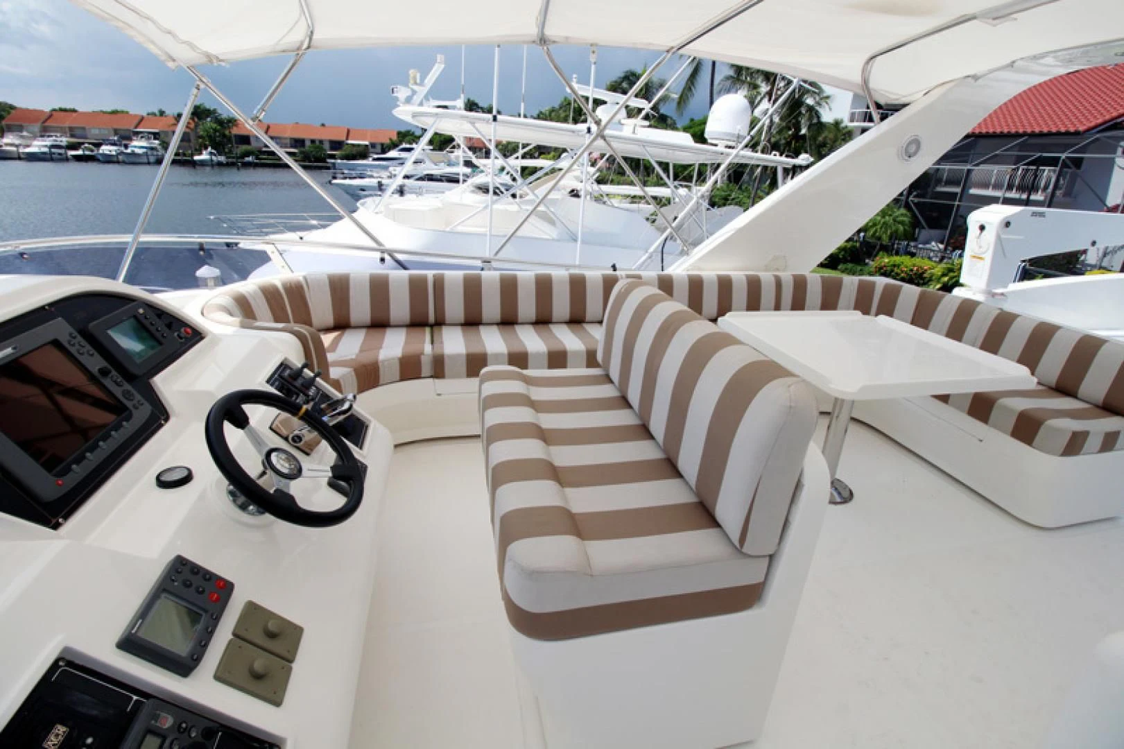 a white boat with a white deck and a white chair on it aboard ALWAYS SOMETHING Yacht for Sale