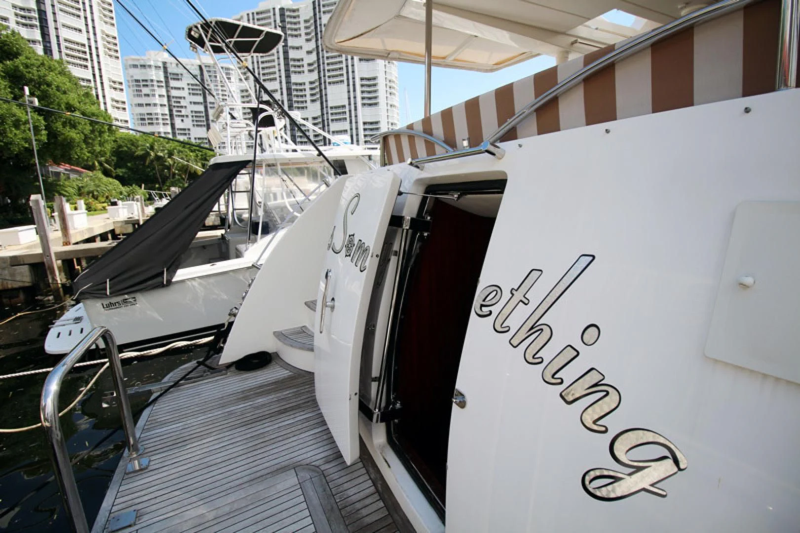 a boat with a sign on the front aboard ALWAYS SOMETHING Yacht for Sale