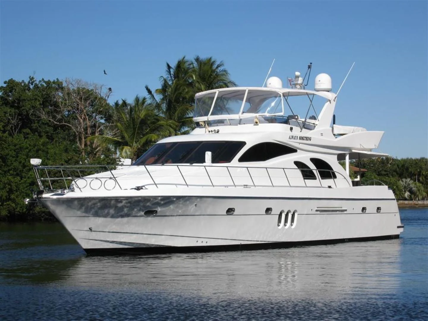 a white yacht on the water aboard ALWAYS SOMETHING Yacht for Sale