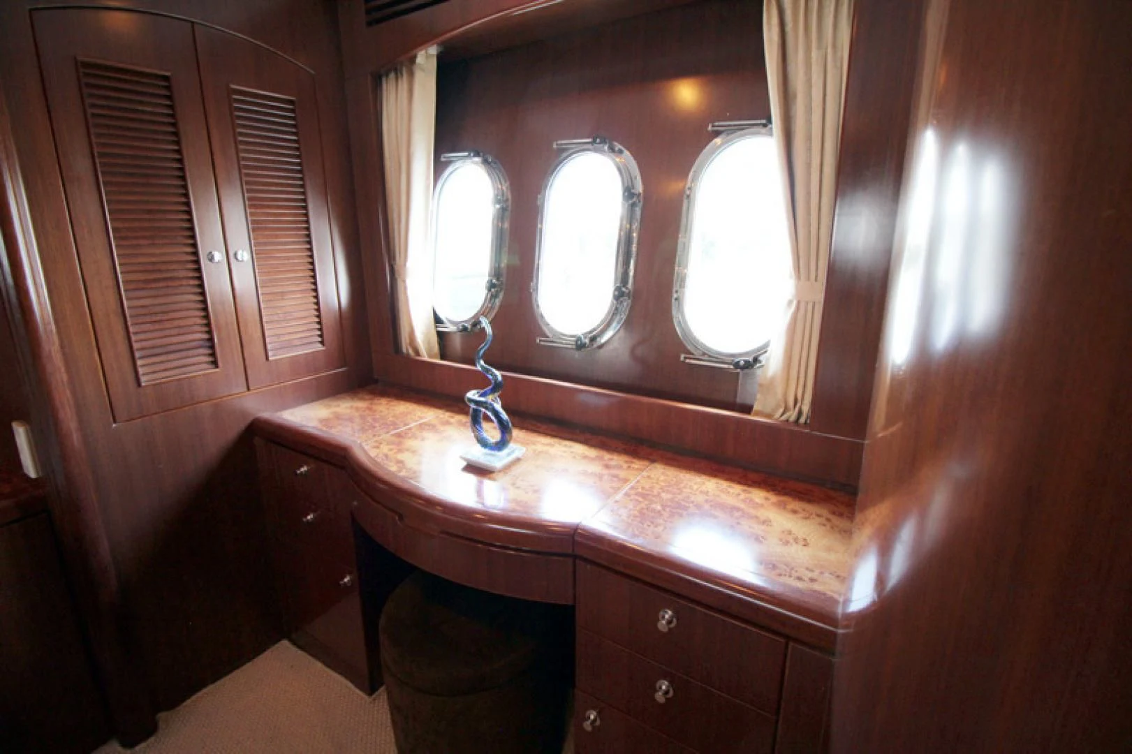 a bathroom with a vanity and mirrors aboard ALWAYS SOMETHING Yacht for Sale