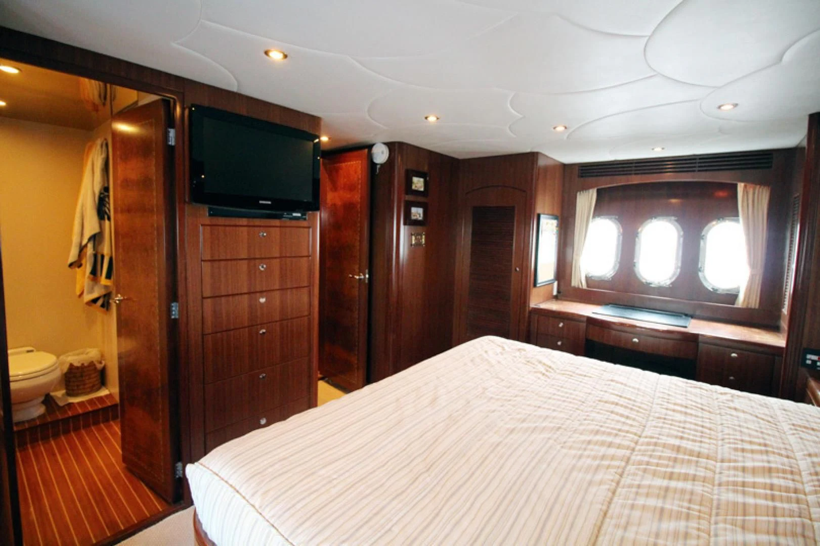 a bed in a room aboard ALWAYS SOMETHING Yacht for Sale
