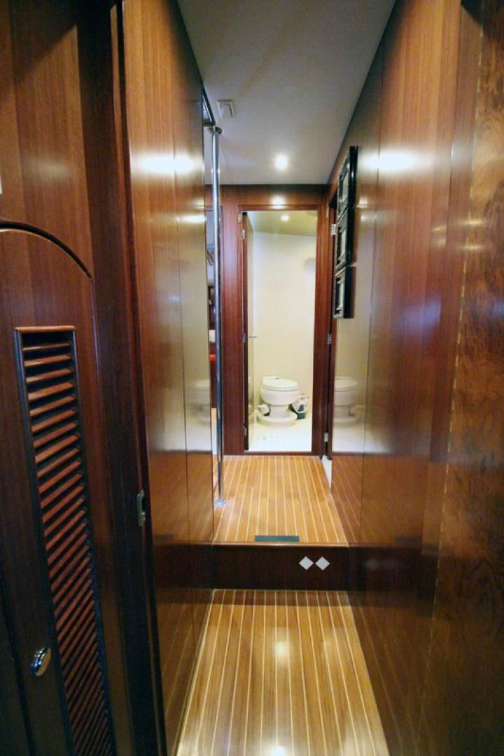 a bathroom with a wood floor aboard ALWAYS SOMETHING Yacht for Sale