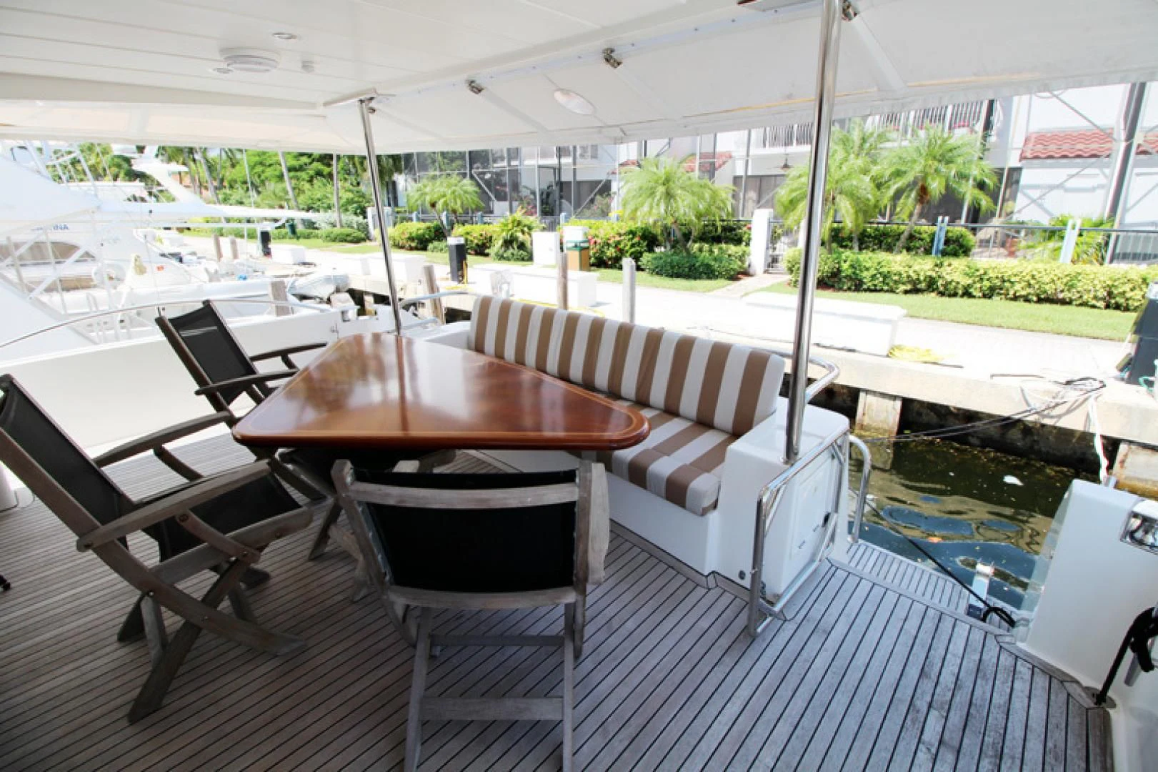 a table and chairs on a deck aboard ALWAYS SOMETHING Yacht for Sale