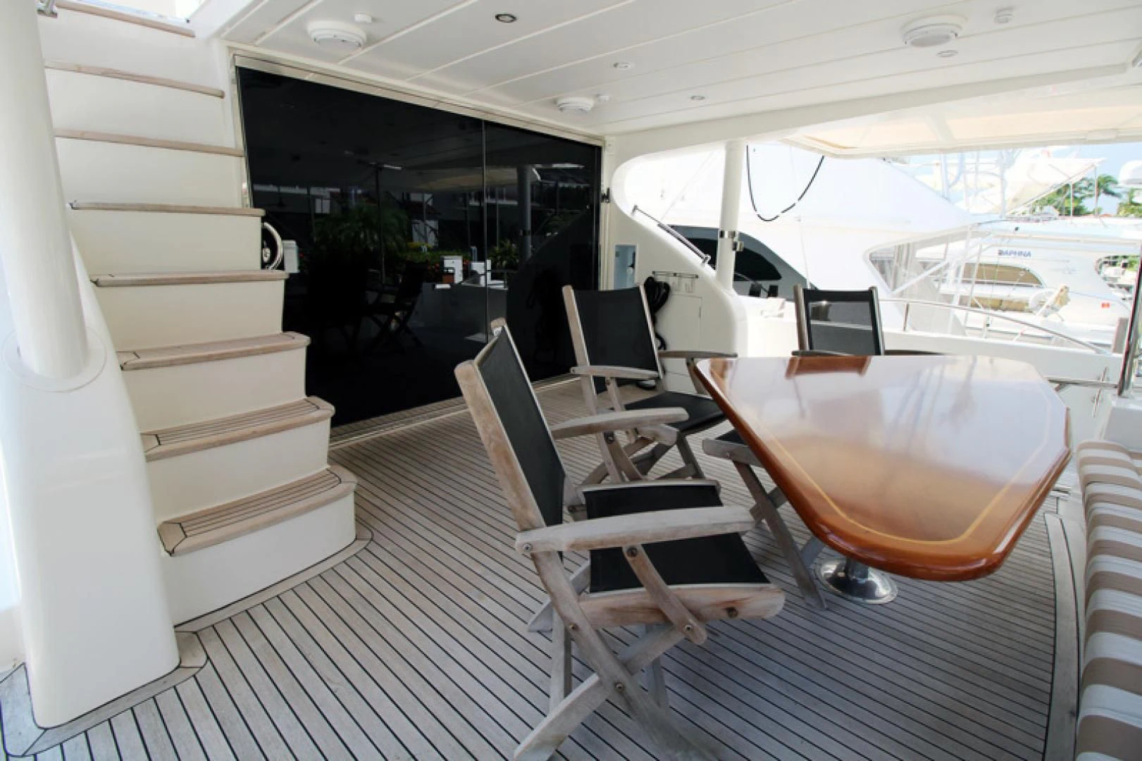 a boat with a table and chairs aboard ALWAYS SOMETHING Yacht for Sale