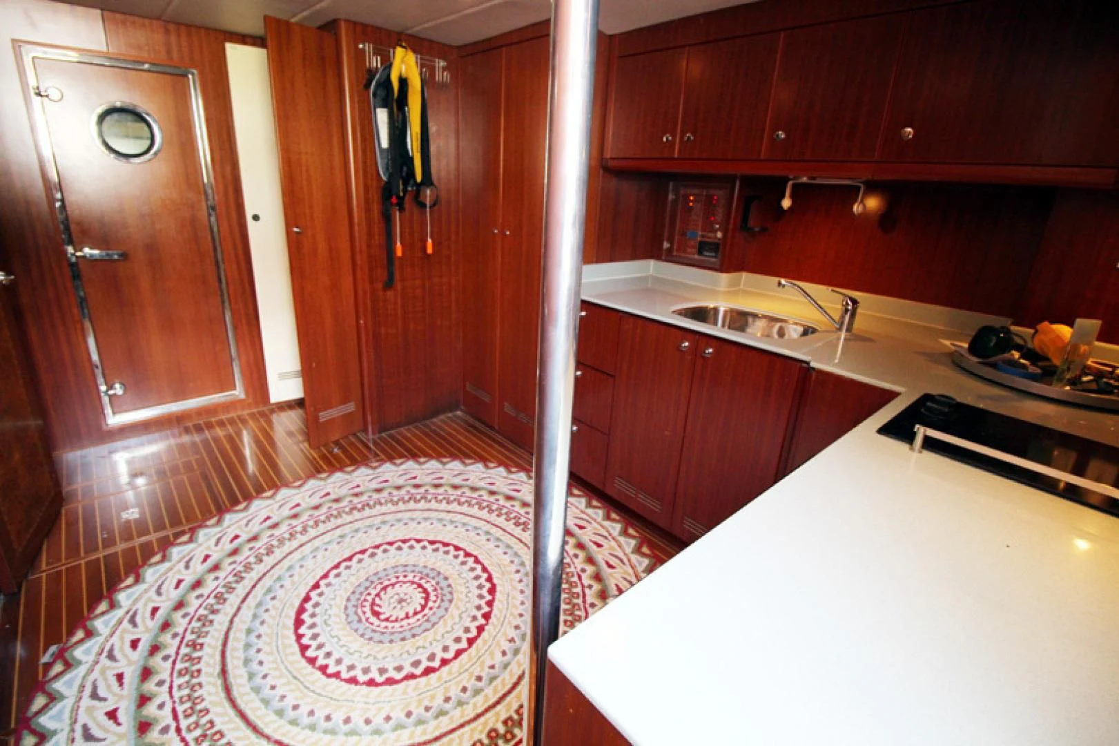 a kitchen with a red rug aboard ALWAYS SOMETHING Yacht for Sale