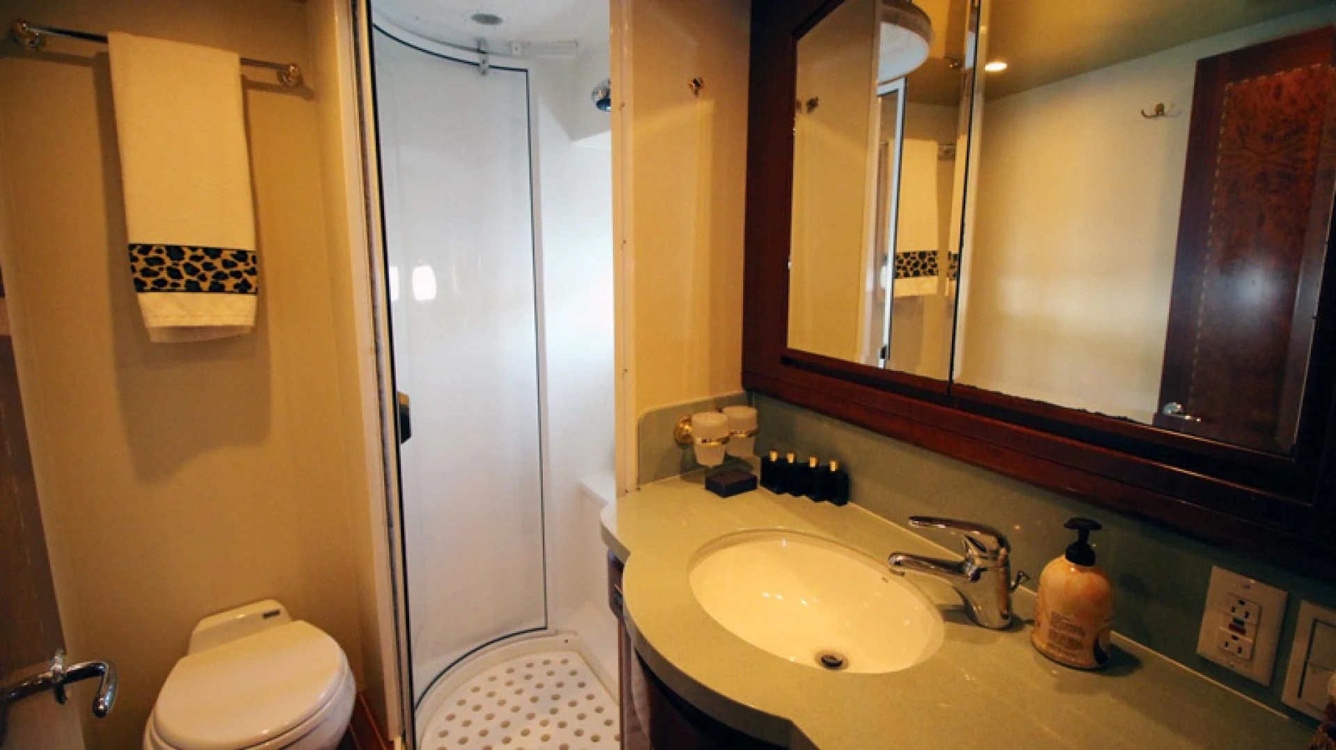 a bathroom with a sink and a mirror aboard ALWAYS SOMETHING Yacht for Sale