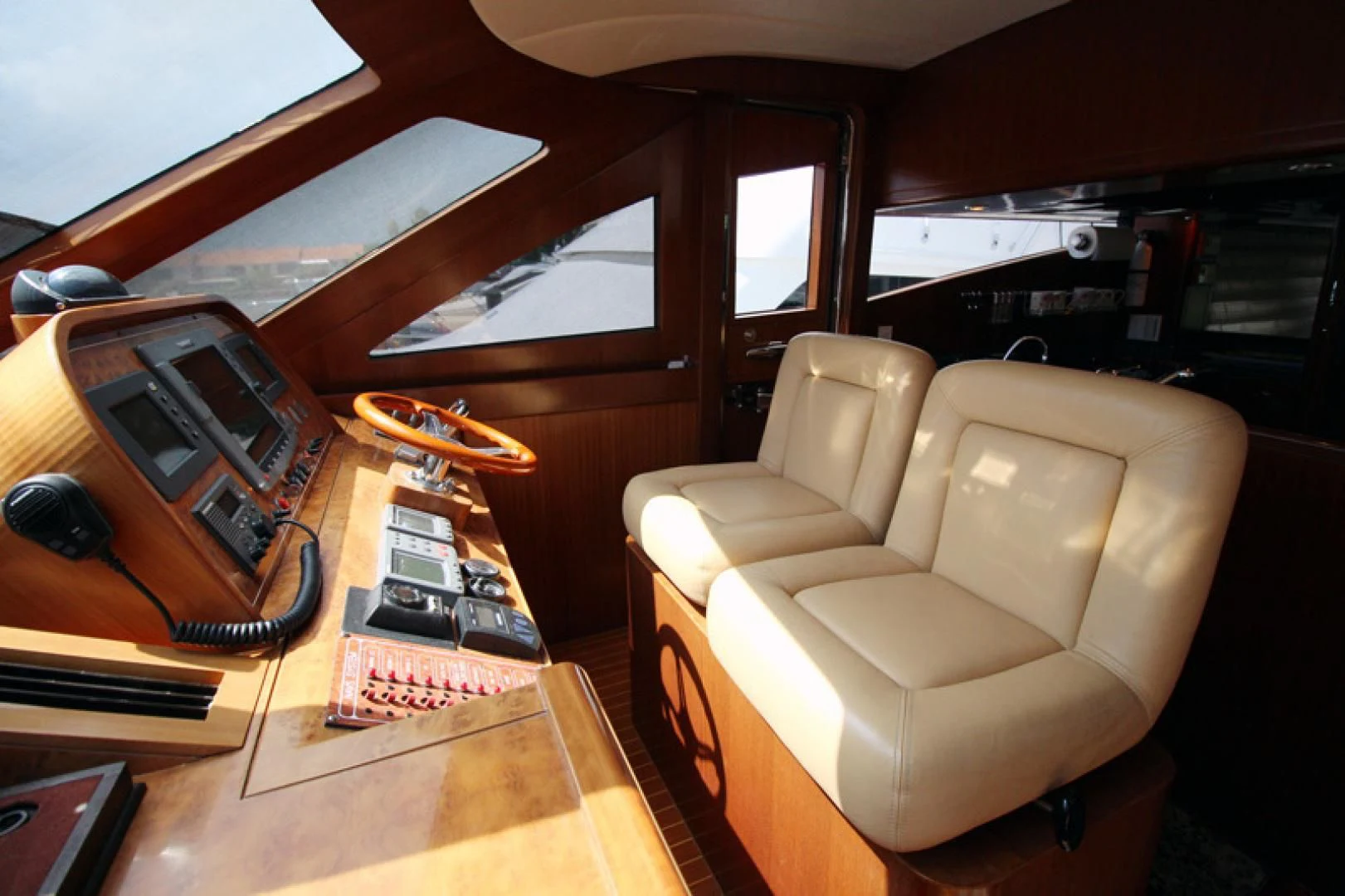 a room with a couch and a desk with a laptop on it aboard ALWAYS SOMETHING Yacht for Sale