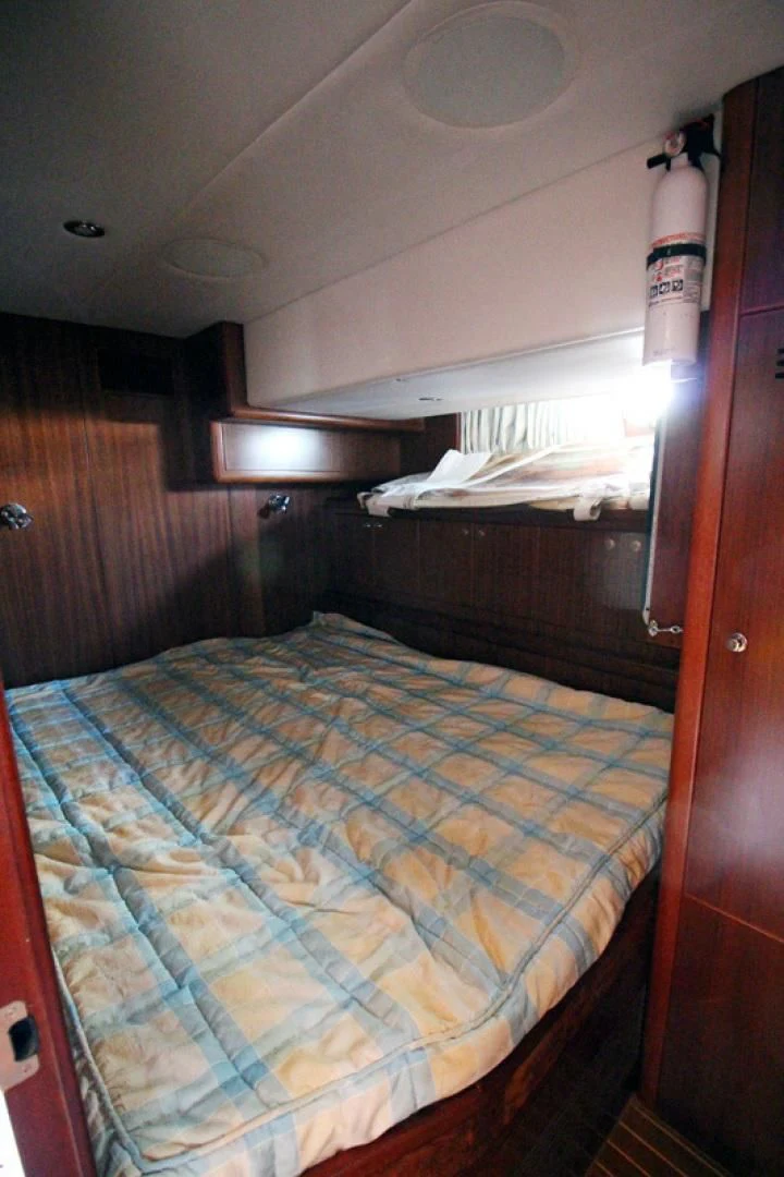 a bed with a blue sheet aboard ALWAYS SOMETHING Yacht for Sale