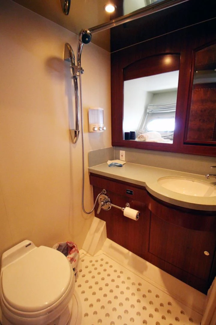 a bathroom with a toilet and a sink aboard ALWAYS SOMETHING Yacht for Sale