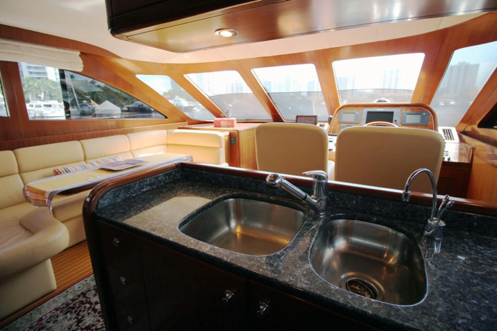 a kitchen with a sink and a large window aboard ALWAYS SOMETHING Yacht for Sale