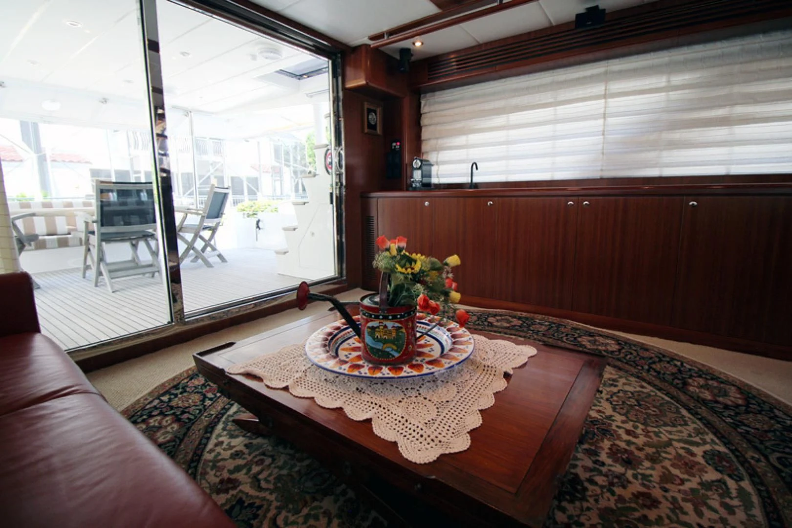 a table with a plate of food on it aboard ALWAYS SOMETHING Yacht for Sale