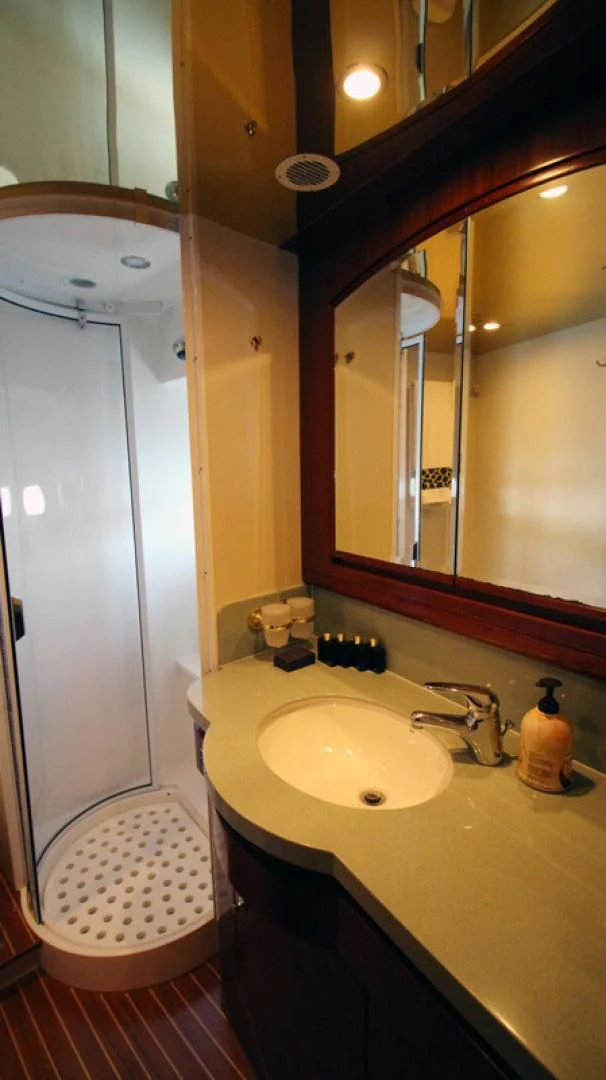 a bathroom with a sink and a mirror aboard ALWAYS SOMETHING Yacht for Sale