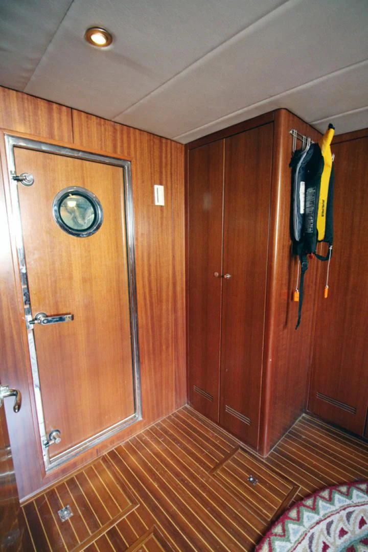 a closet with wooden doors aboard ALWAYS SOMETHING Yacht for Sale