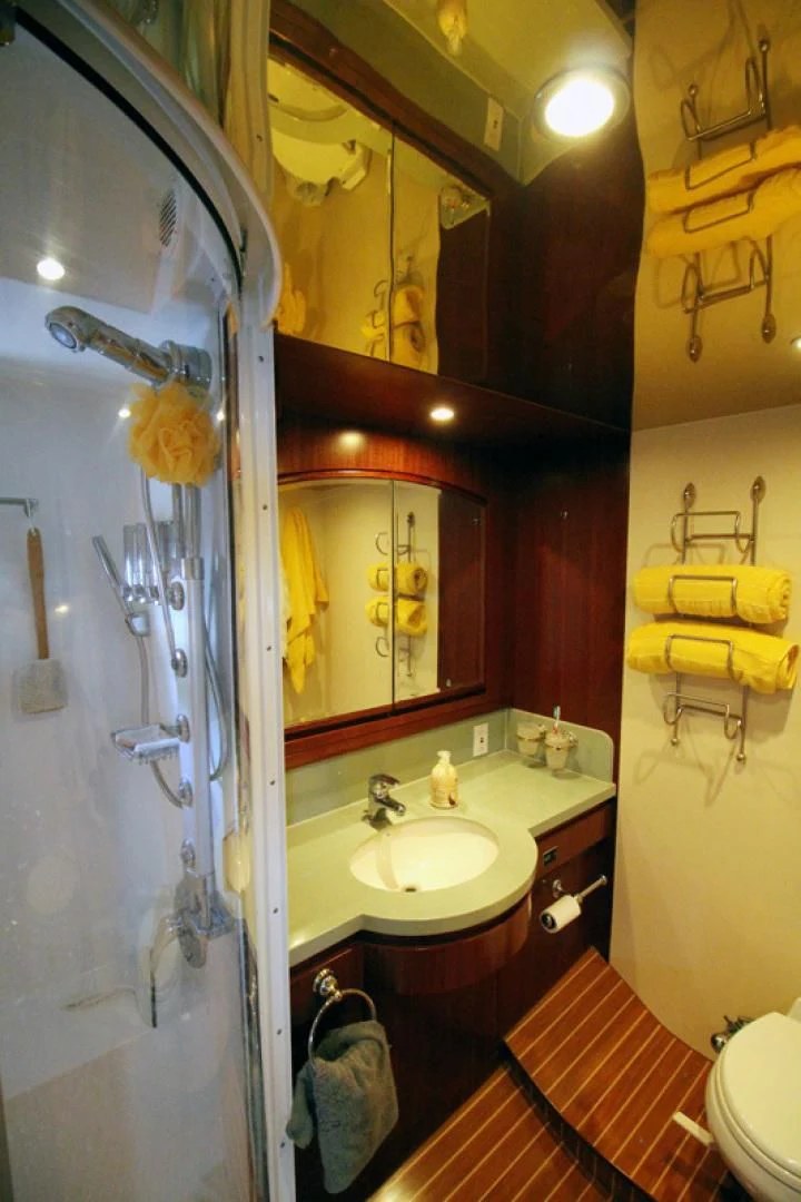 a bathroom with a sink and a mirror aboard ALWAYS SOMETHING Yacht for Sale