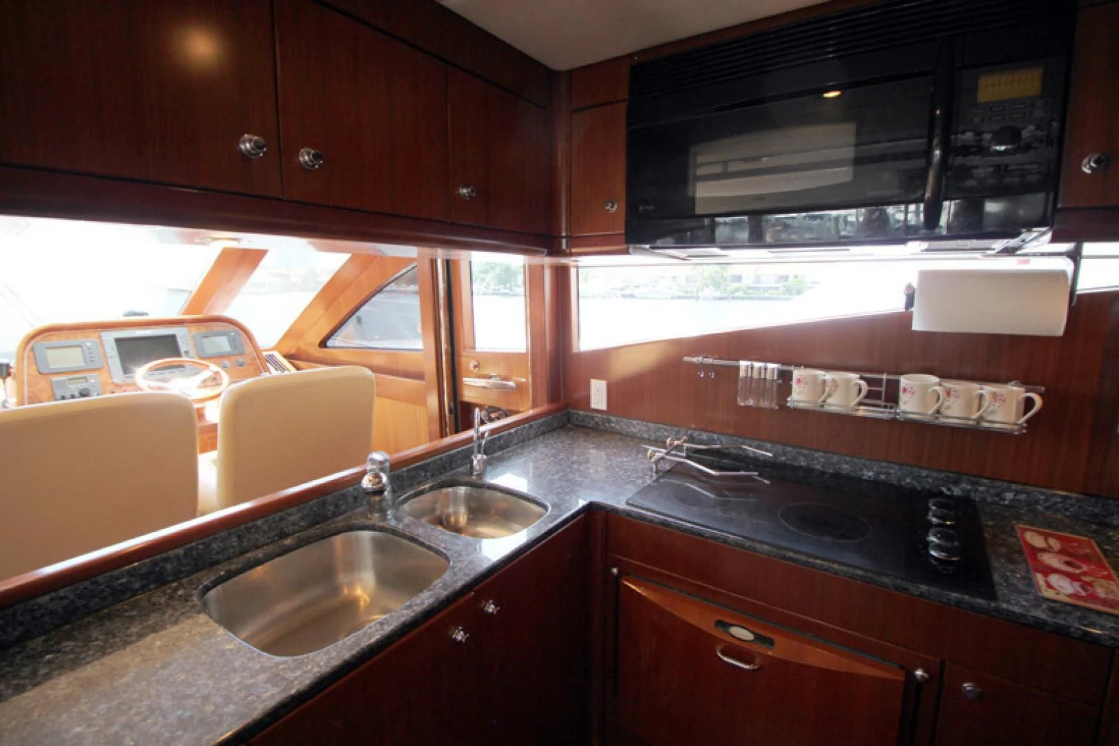 a kitchen with a sink and a microwave aboard ALWAYS SOMETHING Yacht for Sale