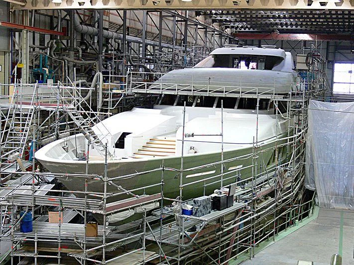 a large white boat in a warehouse aboard MAJESTIC Yacht for Sale