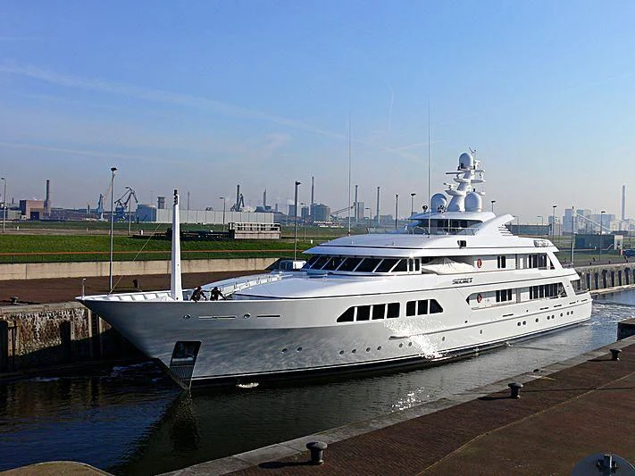 a white yacht docked at a dock aboard MAJESTIC Yacht for Sale