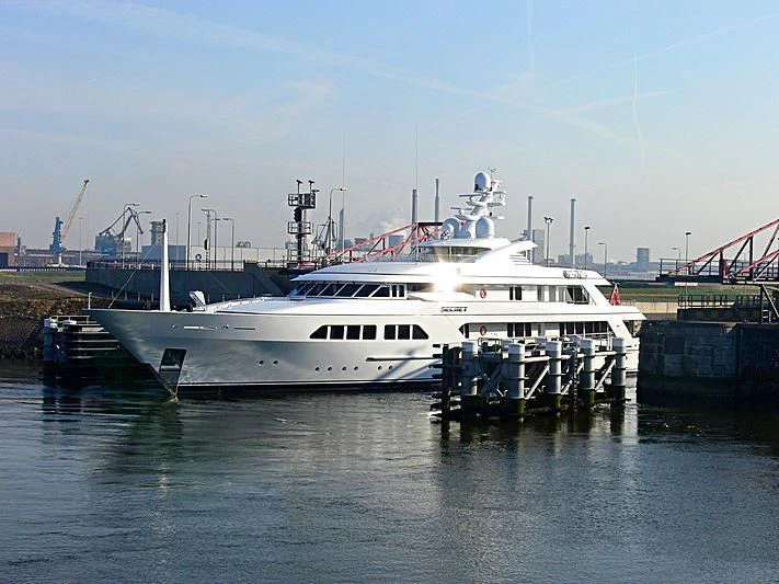 a white boat in a harbor aboard MAJESTIC Yacht for Sale