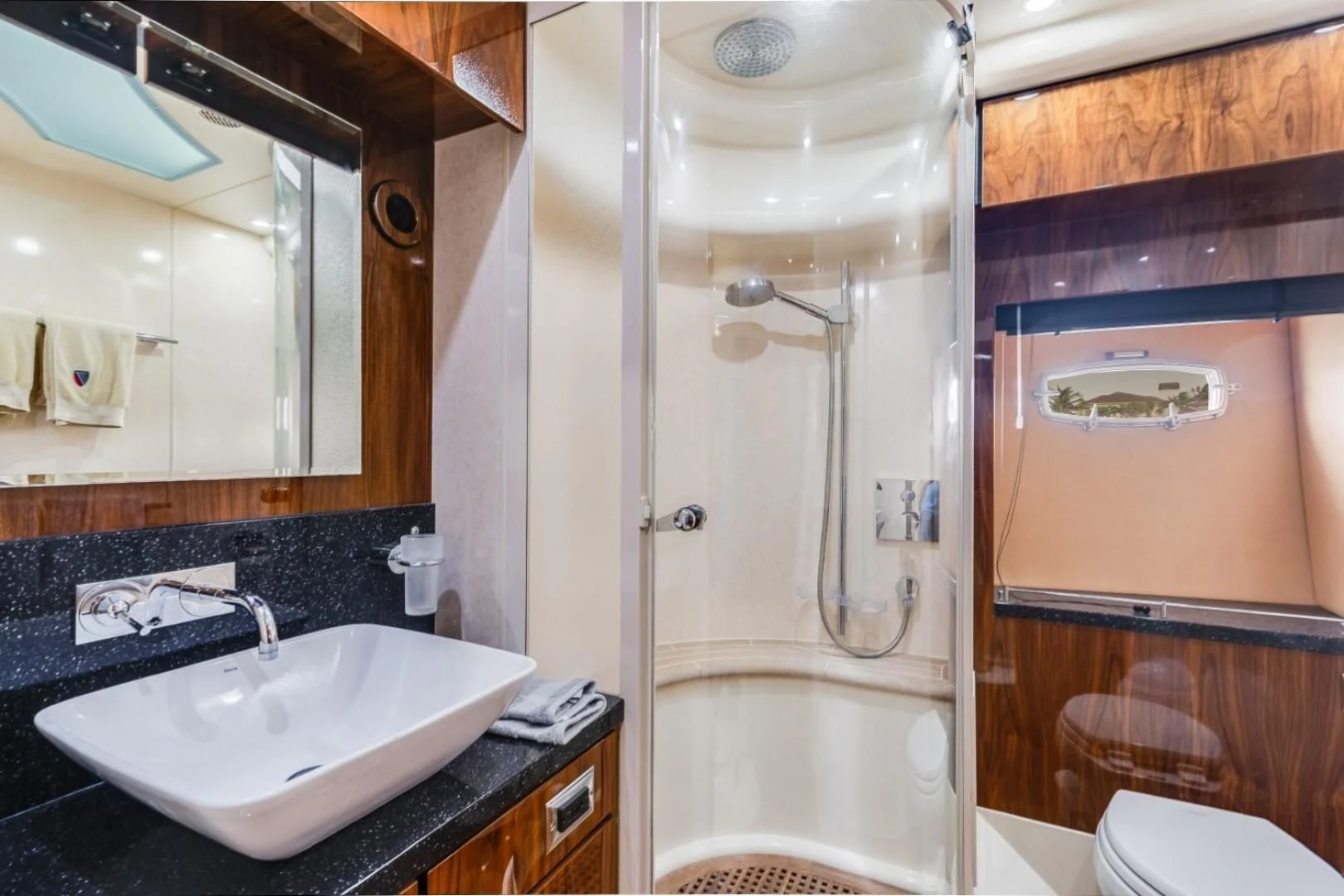 a bathroom with a shower and sink aboard DIRECT TO Yacht for Sale