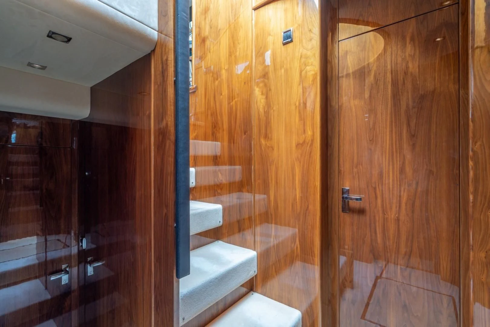 a bathroom with wood cabinets aboard DIRECT TO Yacht for Sale