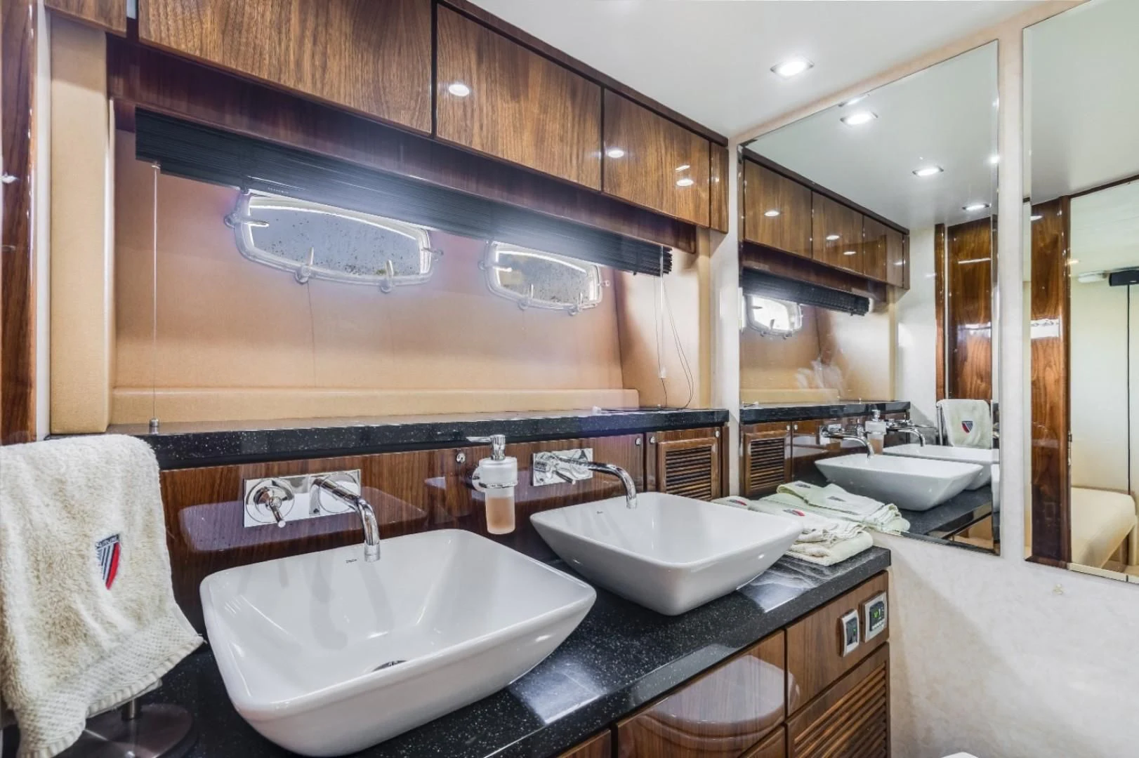 a bathroom with two sinks aboard DIRECT TO Yacht for Sale