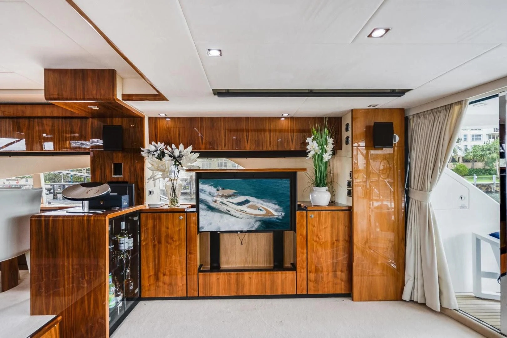 a room with a tv and cabinets aboard DIRECT TO Yacht for Sale