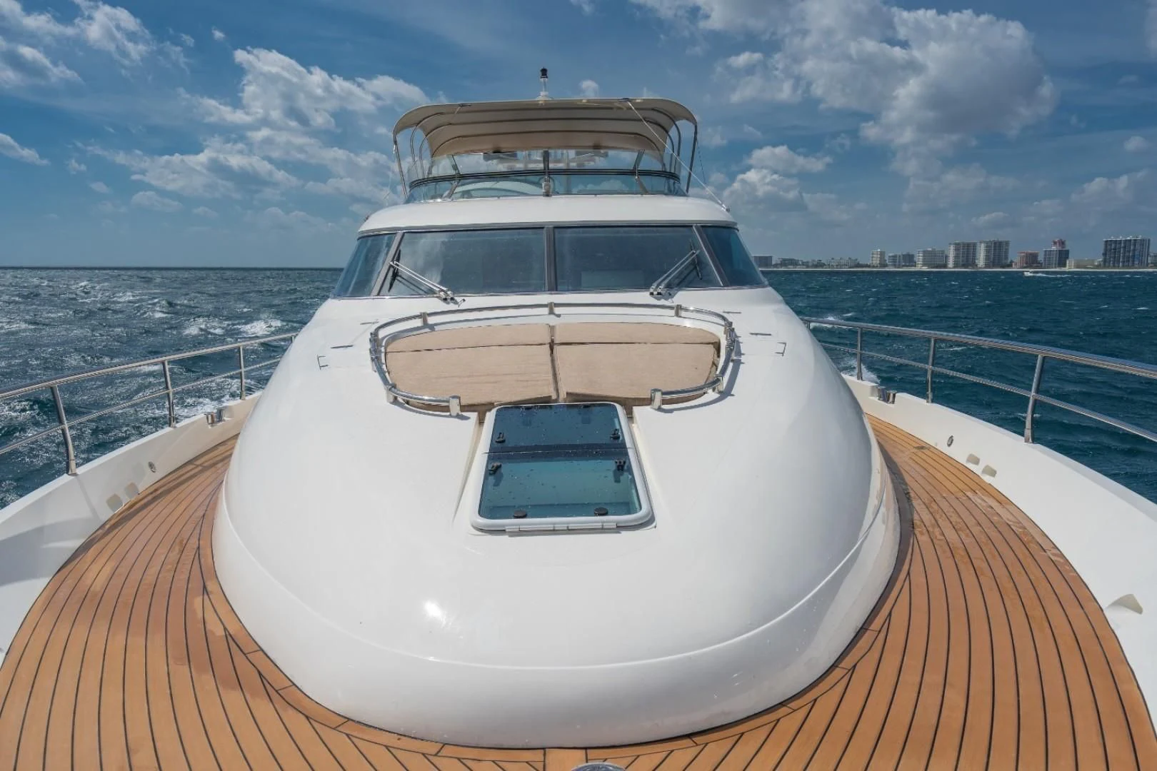a white yacht on a deck aboard DIRECT TO Yacht for Sale