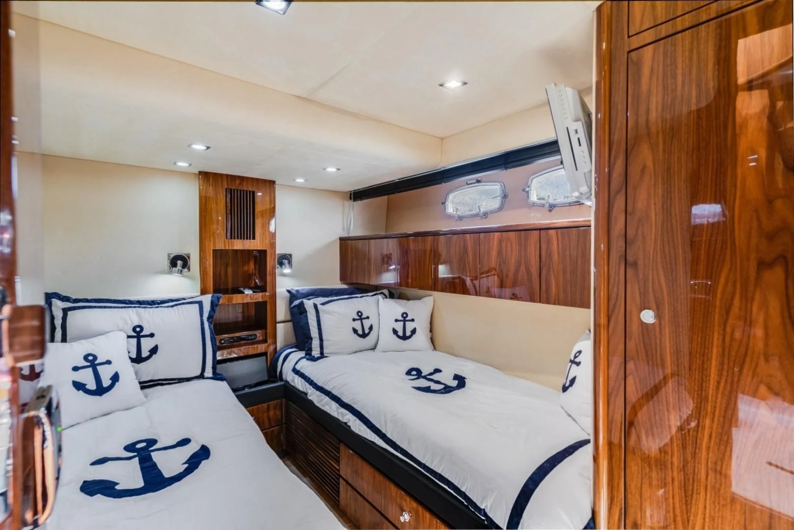 a bedroom with a couple of beds aboard DIRECT TO Yacht for Sale