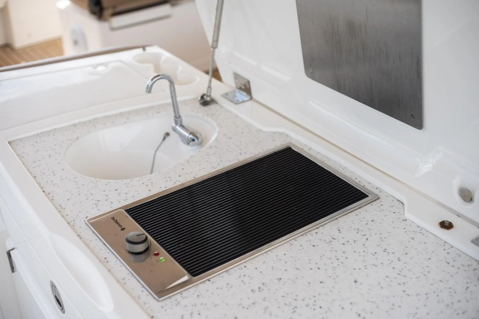 a sink with a black and white checkered shower curtain aboard DIRECT TO Yacht for Sale