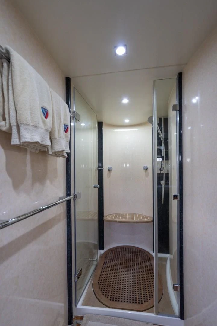 a bathroom with a shower aboard DIRECT TO Yacht for Sale