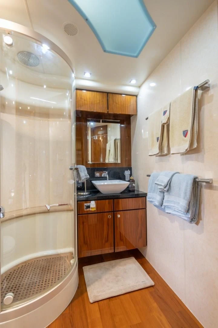 a bathroom with a sink and a shower aboard DIRECT TO Yacht for Sale