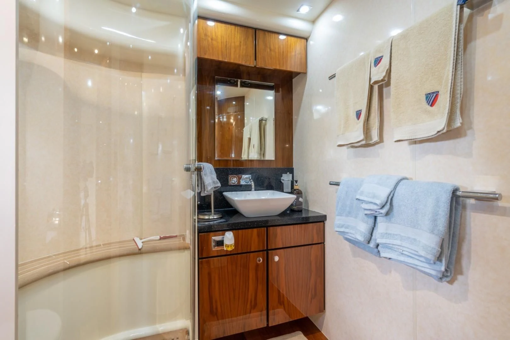 a bathroom with a sink and a bathtub aboard DIRECT TO Yacht for Sale