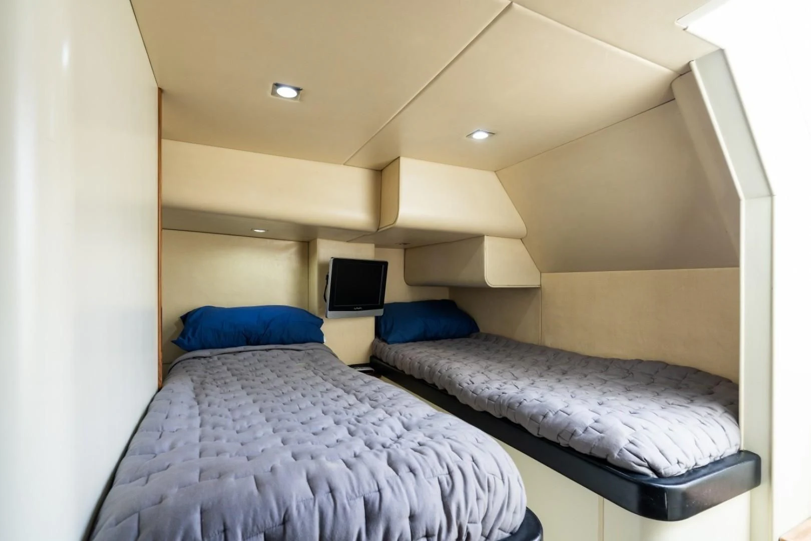 a couple of beds in a room aboard DIRECT TO Yacht for Sale