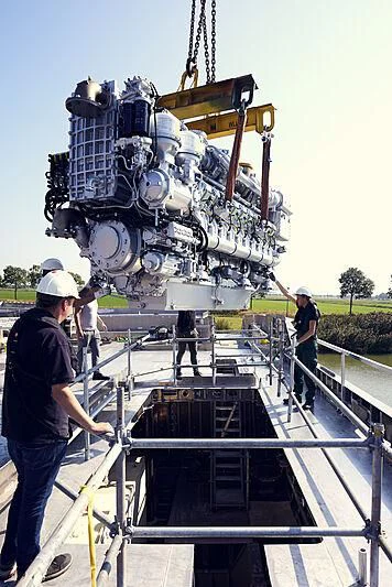 a group of men working on a large machine aboard ULTRA G Yacht for Sale