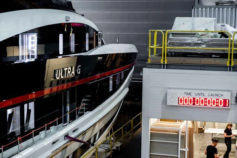 a large white and red boat aboard ULTRA G Yacht for Sale