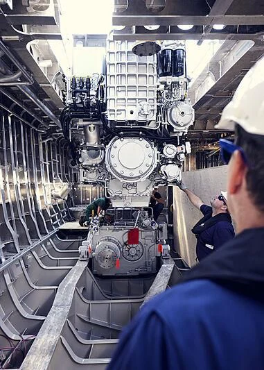 a group of people working on a machine aboard ULTRA G Yacht for Sale