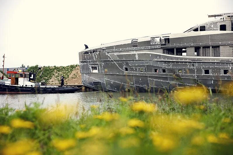 a building with a body of water in front of it aboard ULTRA G Yacht for Sale