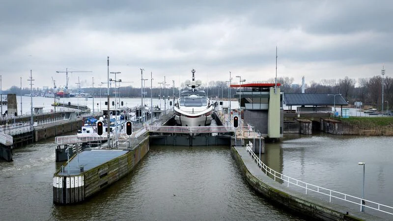 a couple of boats sit in a harbor aboard ULTRA G Yacht for Sale