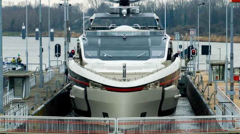 a large white boat docked at a pier aboard ULTRA G Yacht for Sale