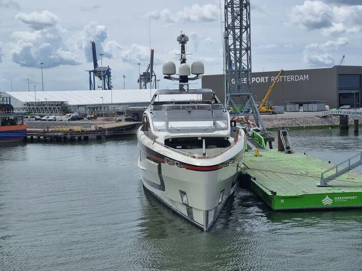 a large white ship in a harbor aboard ULTRA G Yacht for Sale