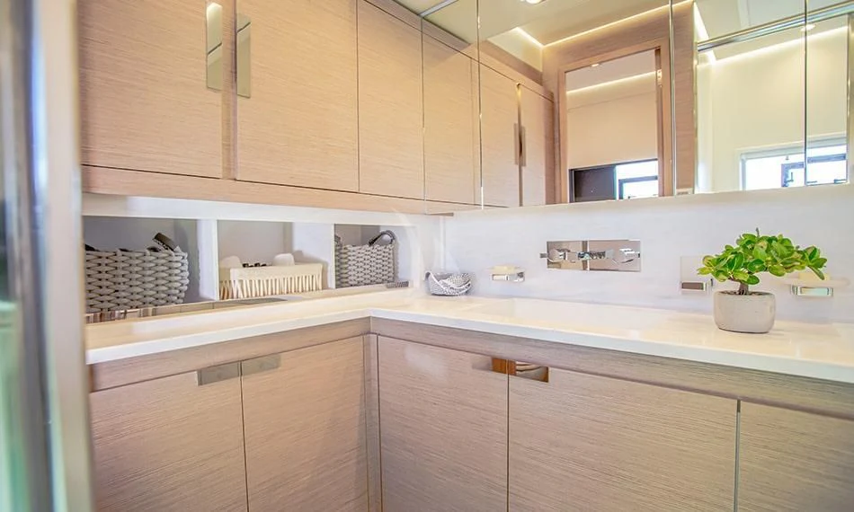 a kitchen with wooden cabinets aboard PRINCESS MILA Yacht for Charter