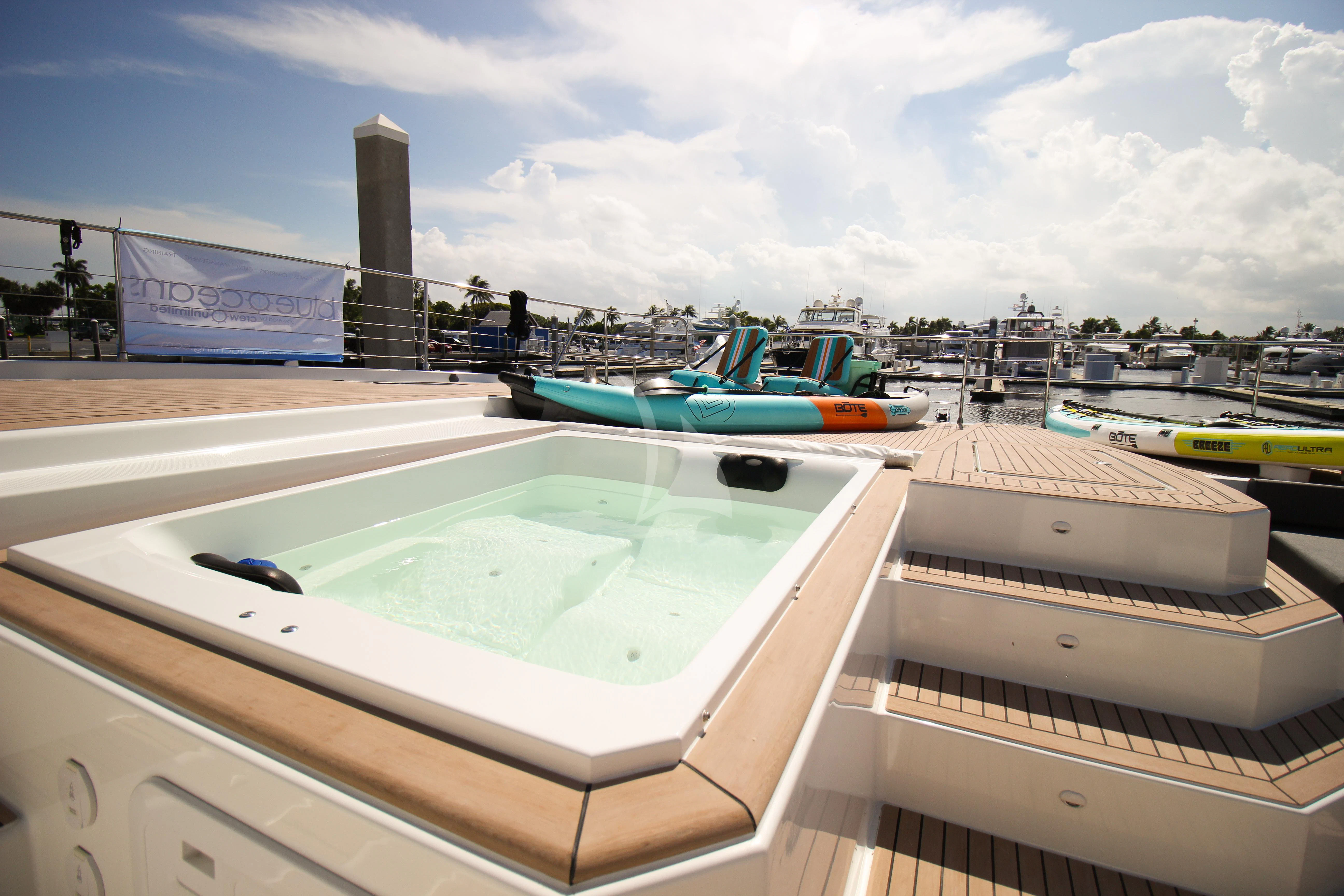 a rooftop with boats and a water slide aboard PRINCESS MILA Yacht for Charter