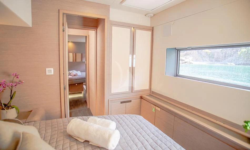 a room with a bed and a window aboard PRINCESS MILA Yacht for Charter