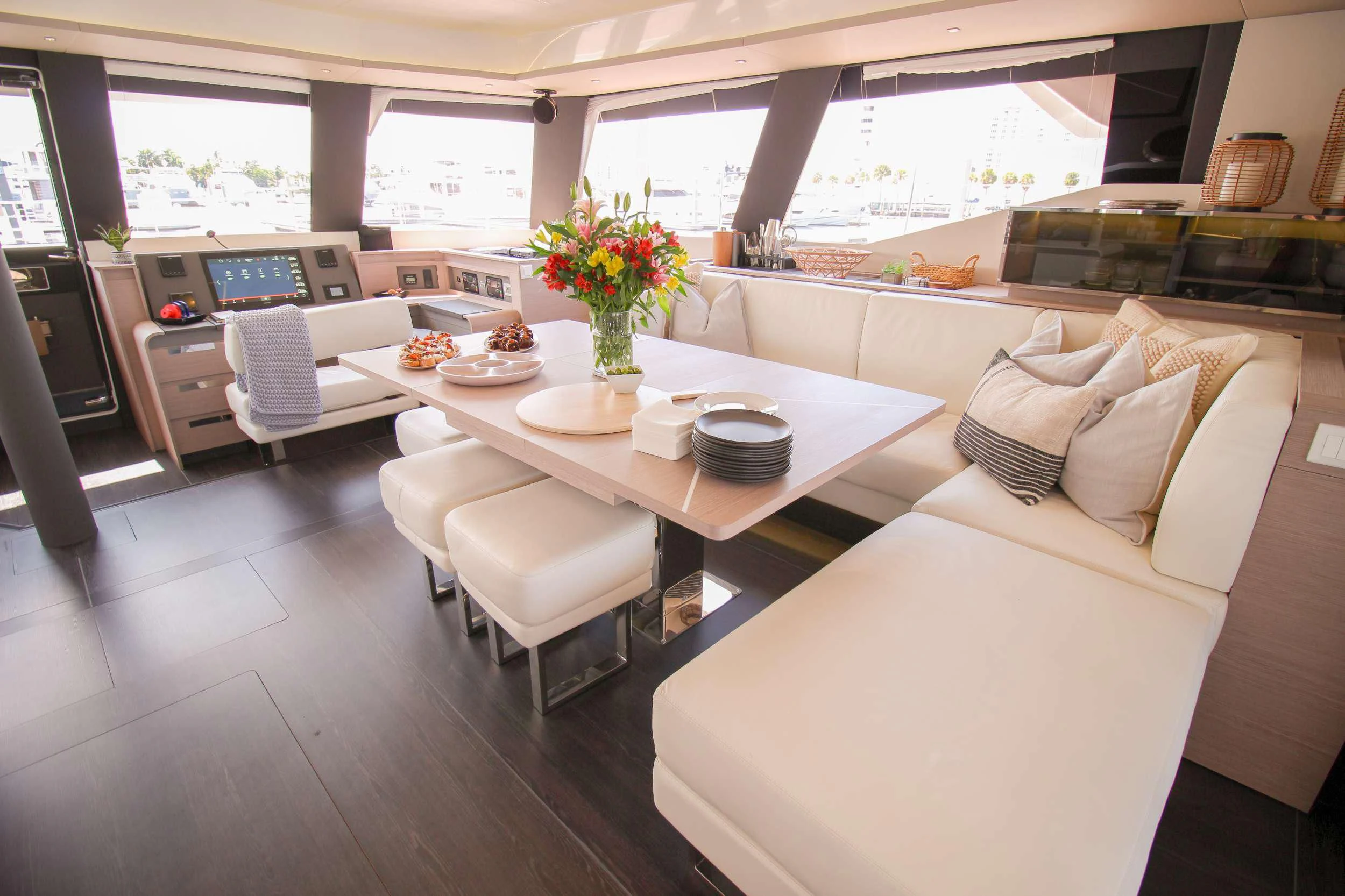 a room with a table chairs and a couch aboard PRINCESS MILA Yacht for Charter